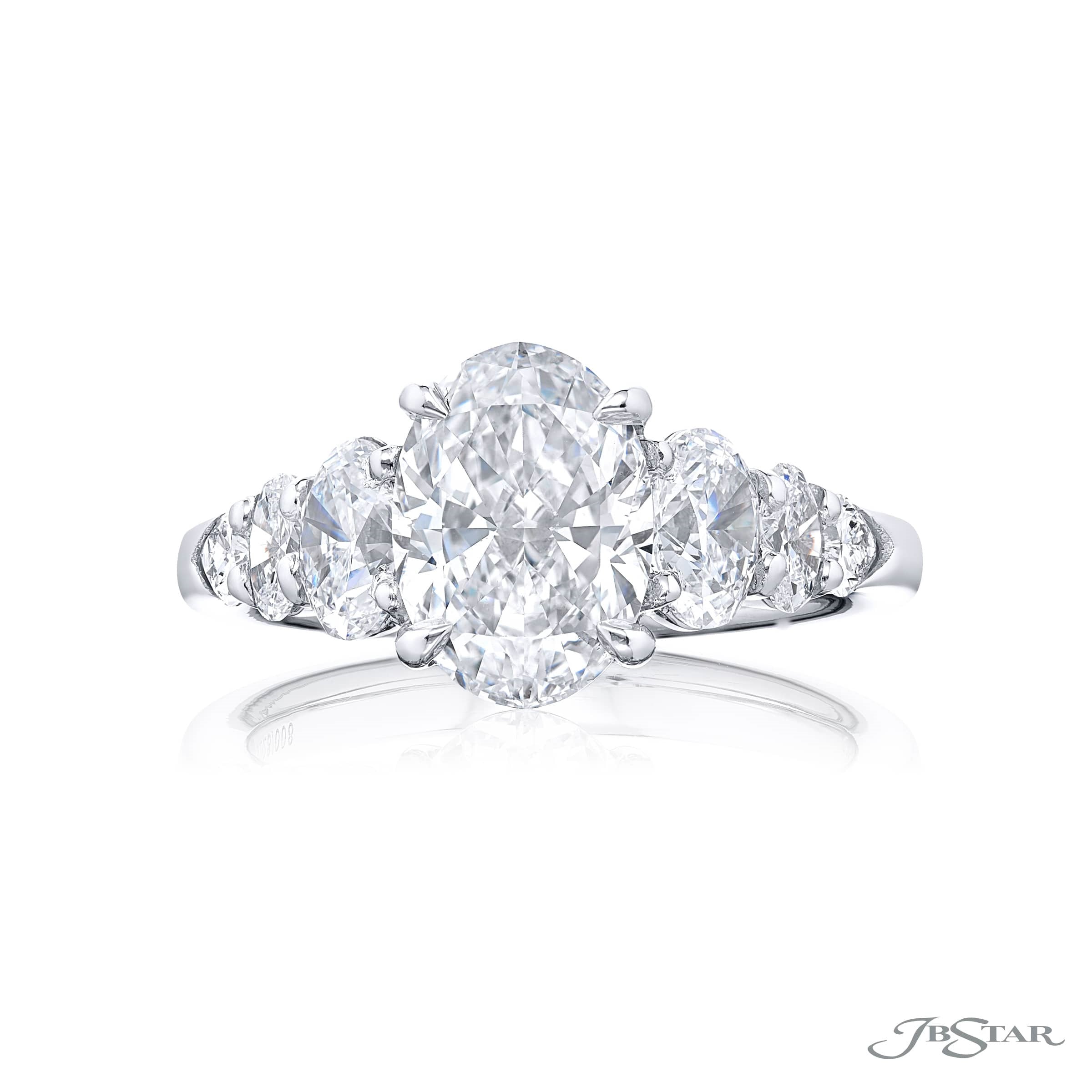 UNIQUE 1.91 CT. CERTIFIED DIAMOND RING. THIS OVAL DIAMOND ACCOMPANIED BY SHIELD AND OVAL DIAMONDS IS HANDCRAFTED IN PURE PLATINUM.