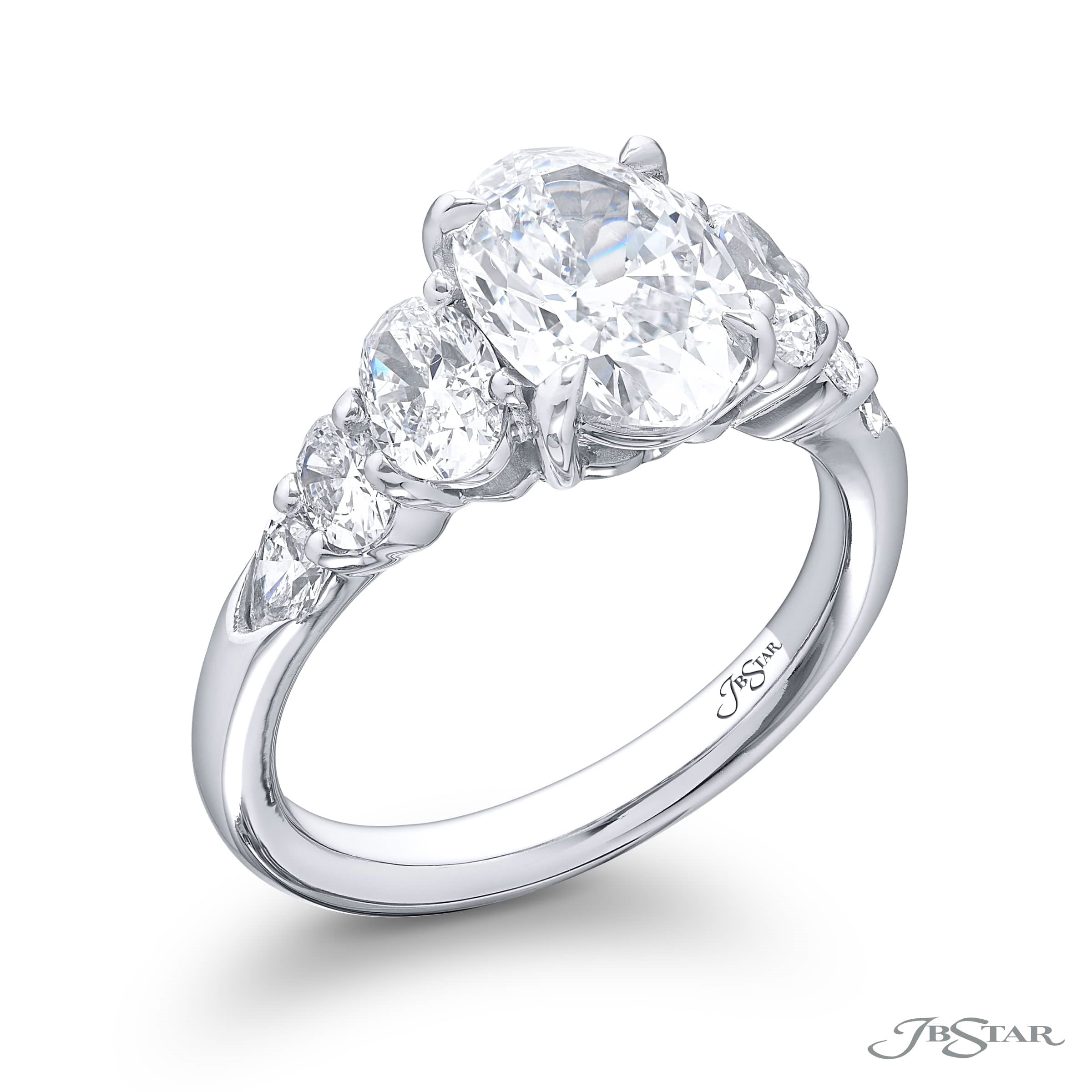 UNIQUE 1.91 CT. CERTIFIED DIAMOND RING. THIS OVAL DIAMOND ACCOMPANIED BY SHIELD AND OVAL DIAMONDS IS HANDCRAFTED IN PURE PLATINUM.