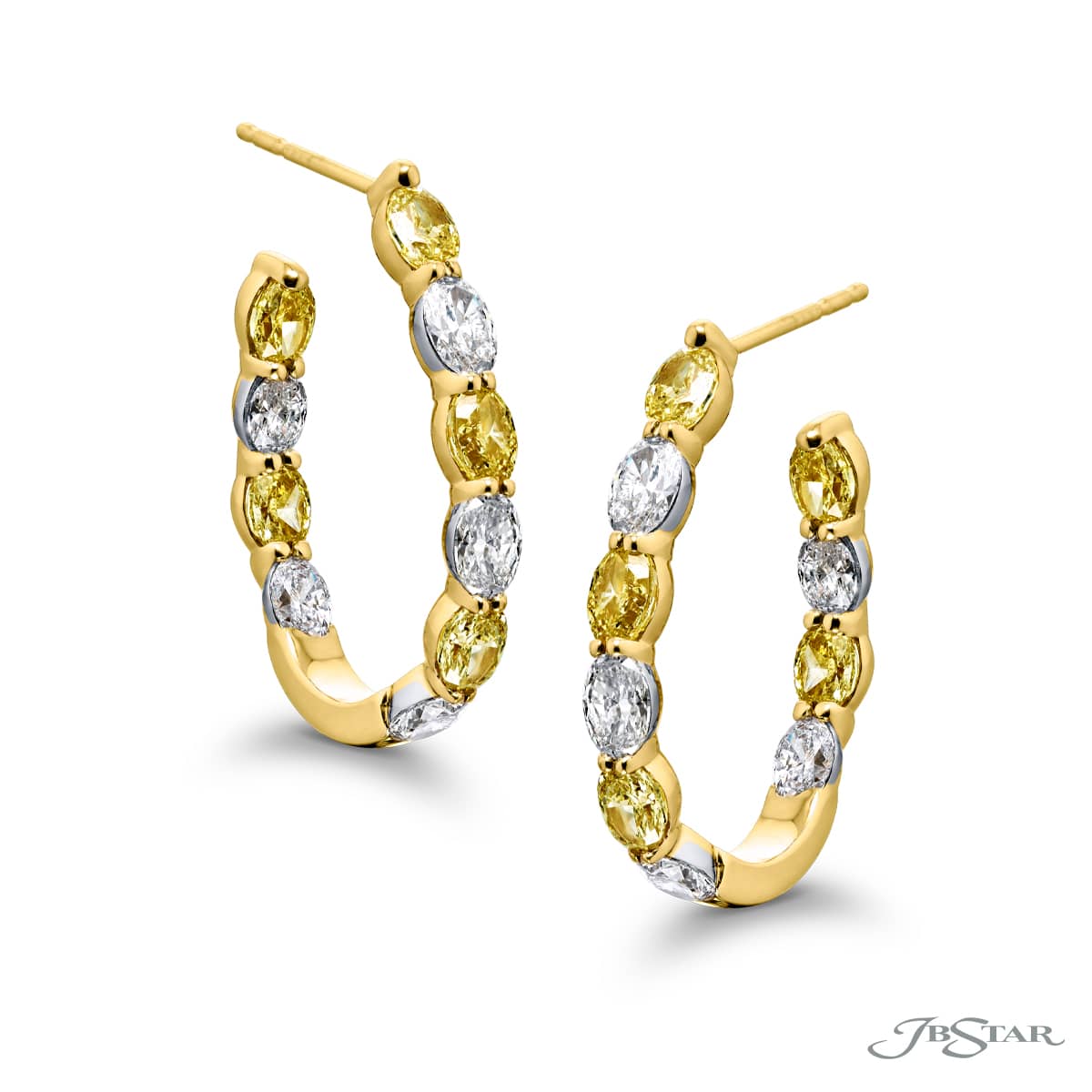 GORGEOUS GLAMOUR: OUR TIMELESS FANCY YELLOW DIAMOND HOOP EARRINGS. THESE BEAUTIFUL OVAL FANCY YELLOW DIAMONDS AND ROUND WHITE DIAMONDS ARE HANDCRAFTED IN 18KY GOLD. 1.40CTW