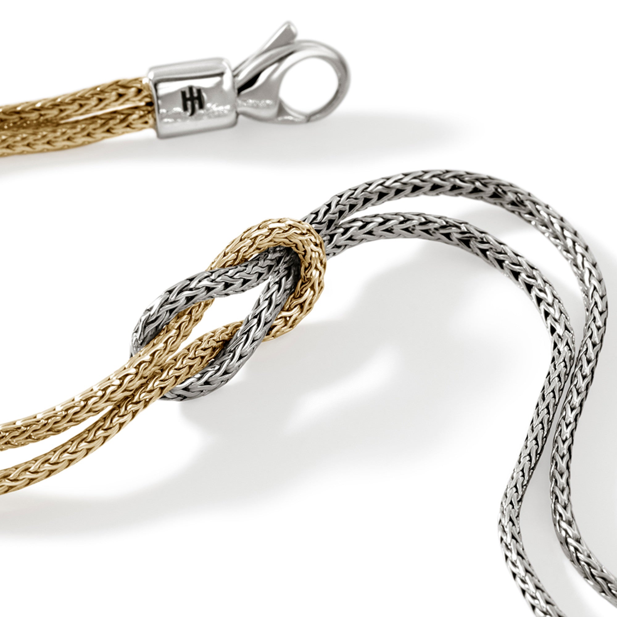 STERLING SILVER AND 14K YELLOW GOLD LOVE KNOT BRACELET