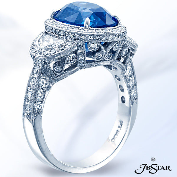 JB STAR SAPPHIRE RING FEATURING A BEAUTIFUL "NO-HEAT" 6.00 CT OVAL BLUE SAPPHIRE EMBRACED BY CAREFUL