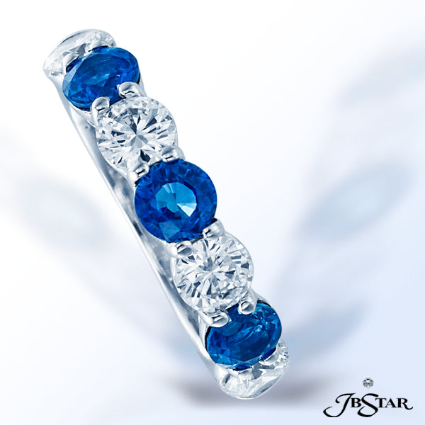 JB STAR BLUE SAPPHIRE AND DIAMOND BAND HANDCRAFTED IN A 7-STONE STYLE, WITH ALTERNATING ROUND BLUE S