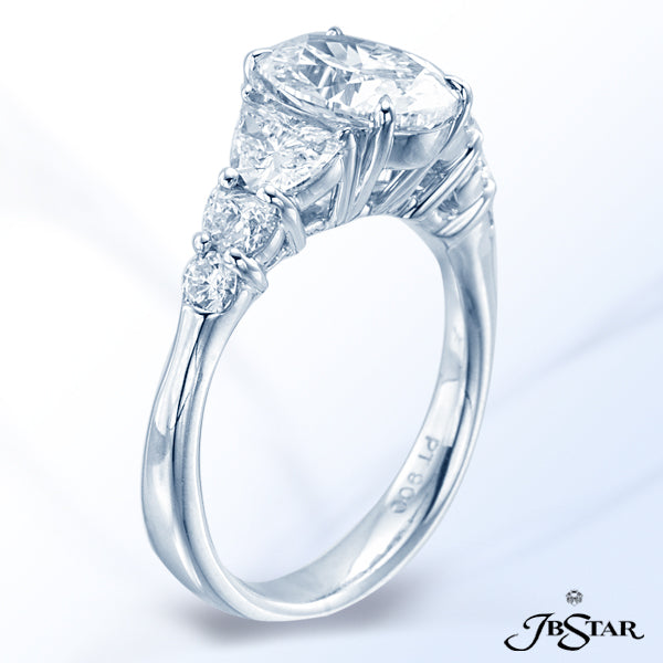 JB STAR DIAMOND PLATINUM RING FEATURING A 2.01 CT OVAL DIAMOND EMBRACED BY PERFECTLY MATCHED HALF MO