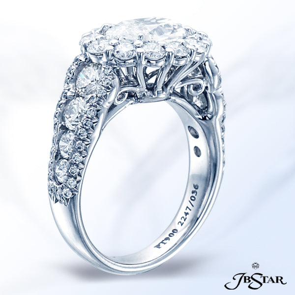 JB STAR DIAMOND ENGAGEMENT RING FEATURING A 1.50 CT OVAL DIAMOND SURROUNDED BY ROUND DIAMONDS AND FU