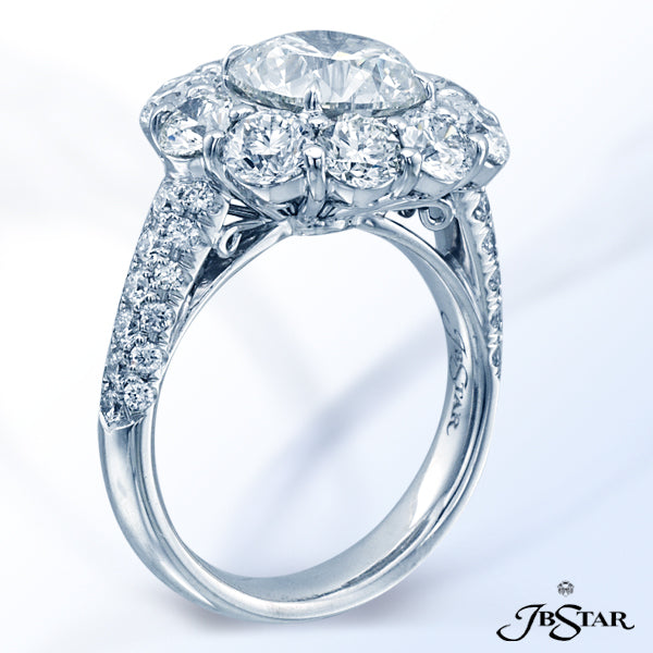 JB STAR PLATINUM DIAMOND RING FEATURING A BEAUTIFUL ROUND BRILLIANT DIAMOND, ENCIRCLED BY 10 PERFECT