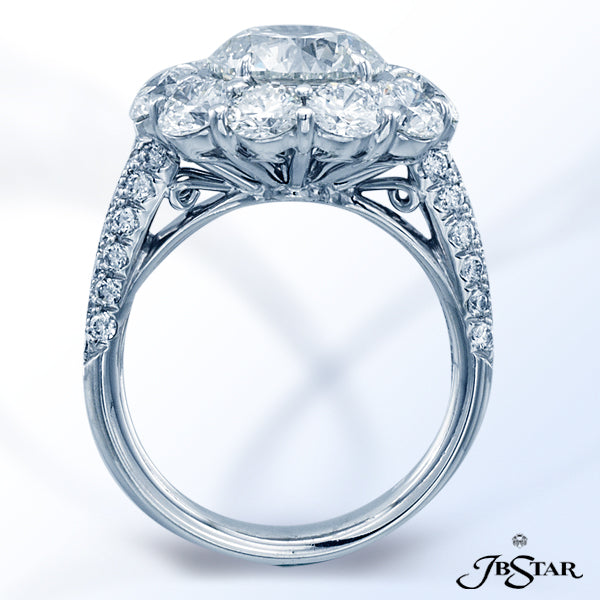 JB STAR PLATINUM DIAMOND RING FEATURING A BEAUTIFUL ROUND BRILLIANT DIAMOND, ENCIRCLED BY 10 PERFECT