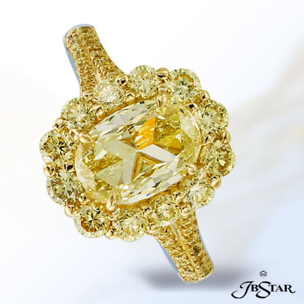 JB STAR NATURAL FANCY YELLOW DIAMOND RING FEATURING A MAGNIFICENT 1.50 CT OVAL FY DIAMOND SURROUNDED