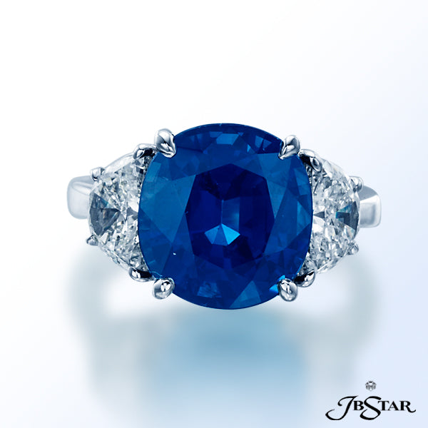 JB STAR EXQUISITE, HANDMADE RING FEATURES A 6.65CT ROUND SAPPHIRE RING WITH HALF MOON DIAMOND SIDES.