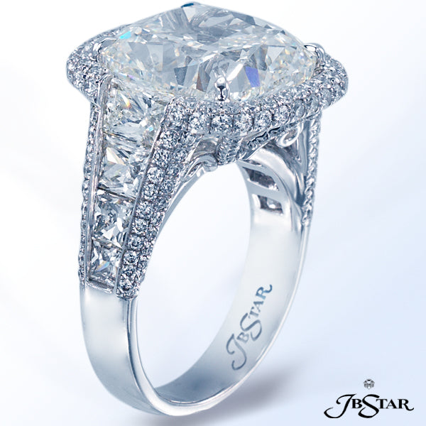 JB STAR THIS STUNNING PLATINUM ENGAGEMENT RING FEATURES A 10.69CT CUSHION DIAMOND ENHANCED WITH TRAP