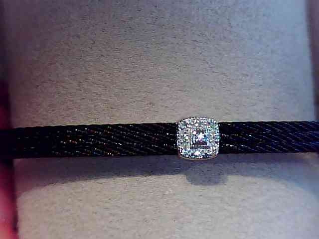 Alor Black cable 3 row 1.6 mm, 18 karat White Gold, 0.05 total carat weight Diamonds and stainless steel. Imported.